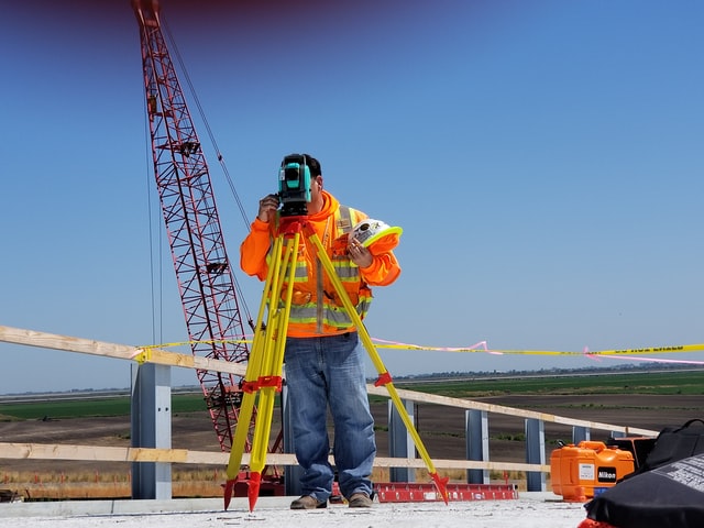 What are the reasons to hire a land surveyor before construction work?